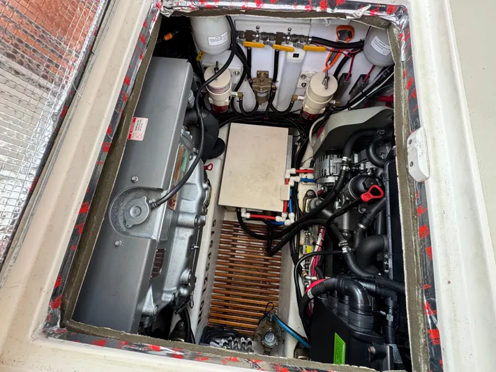 C'est La Vie Yacht Photos Pics Engine compartment of 2010 Bruckmann Bluestar 29.9 boat, showcasing detailed mechanical components.