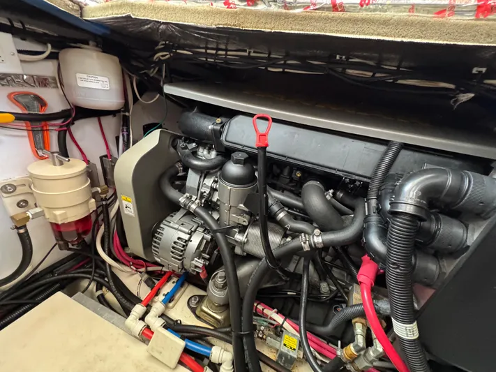 C'est La Vie Yacht Photos Pics Engine compartment of 2010 Bruckmann Bluestar 29.9 boat, showcasing detailed mechanical components.