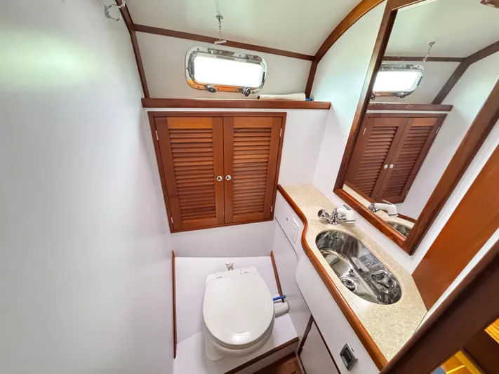 C'est La Vie Yacht Photos Pics Bathroom interior of 2010 Bruckmann Bluestar 29.9 yacht with sink and toilet.