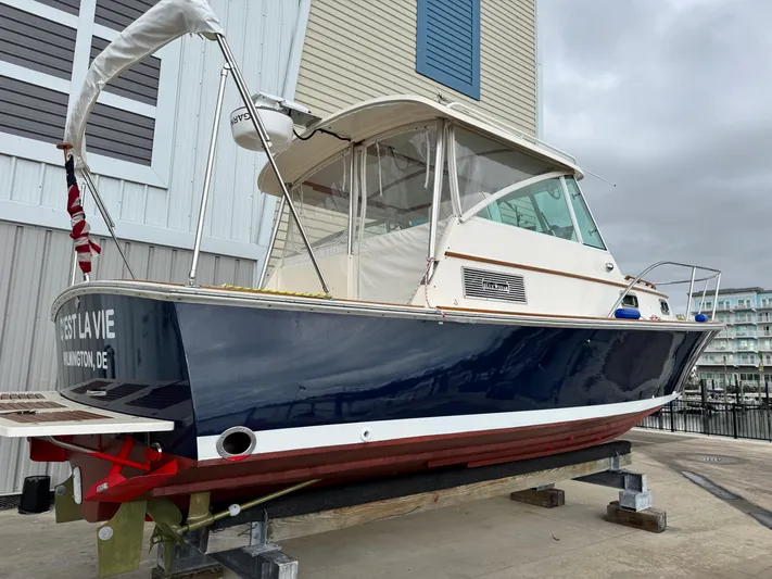 C'est La Vie Yacht Photos Pics 2010 Bruckmann Bluestar 29.9 boat on dry dock, blue hull, marina background.