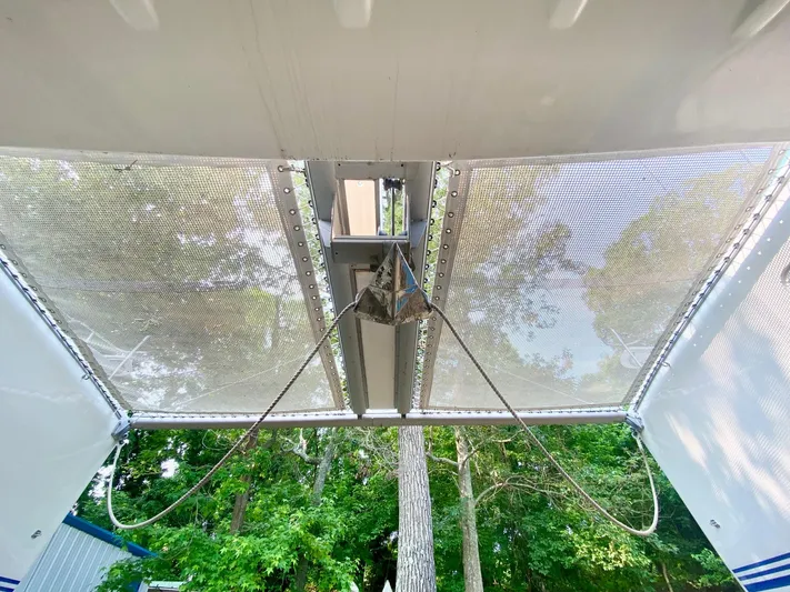 Ronin Yacht Photos Pics View of 2016 Celtic Yachts 40 catamaran netting with trees in the background.