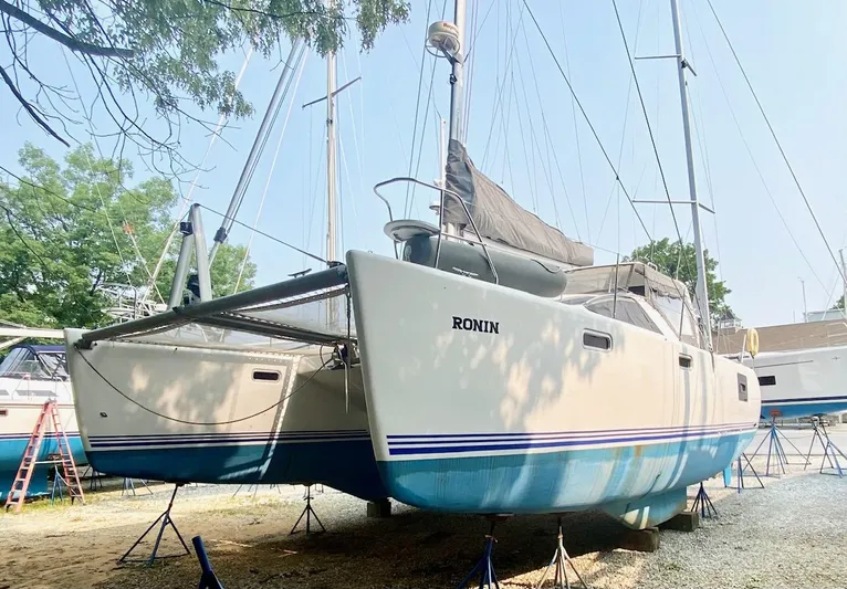 Ronin Yacht Photos Pics 2016 Celtic Yachts 40 catamaran on stands, named "Ronin," with blue and white hull.