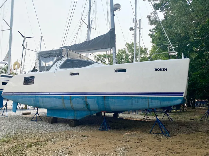 Ronin Yacht Photos Pics 2016 Celtic Yachts 40 sailboat on stands, white hull with blue stripe, named "Ronin."
