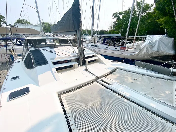 Ronin Yacht Photos Pics 2016 Celtic Yachts 40 sailboat docked, featuring spacious deck and netting, surrounded by other boats.