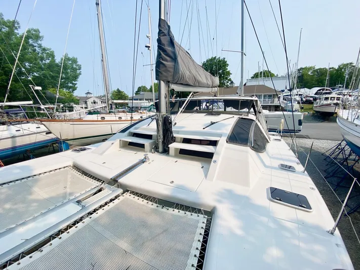 Ronin Yacht Photos Pics 2016 Celtic Yachts 40 catamaran docked at a marina, surrounded by other boats.