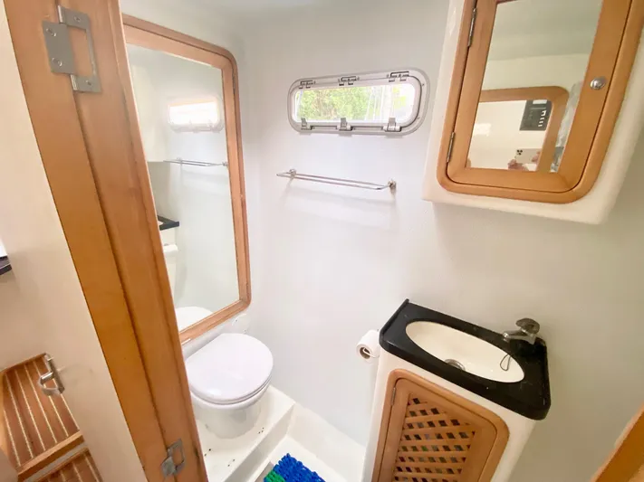 Ronin Yacht Photos Pics Bathroom interior of 2016 Celtic Yachts 40, featuring sink, toilet, and wooden accents.