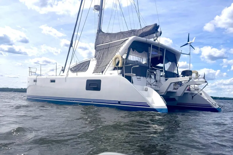 Ronin Yacht Photos Pics 2016 Celtic Yachts 40 catamaran sailing on a sunny day with blue skies.