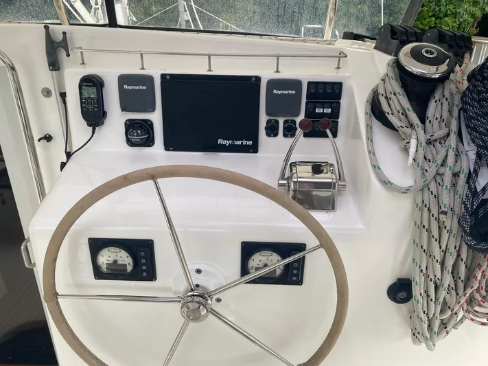 Ronin Yacht Photos Pics Steering wheel and control panel of 2016 Celtic Yachts 40 sailboat with navigation equipment.
