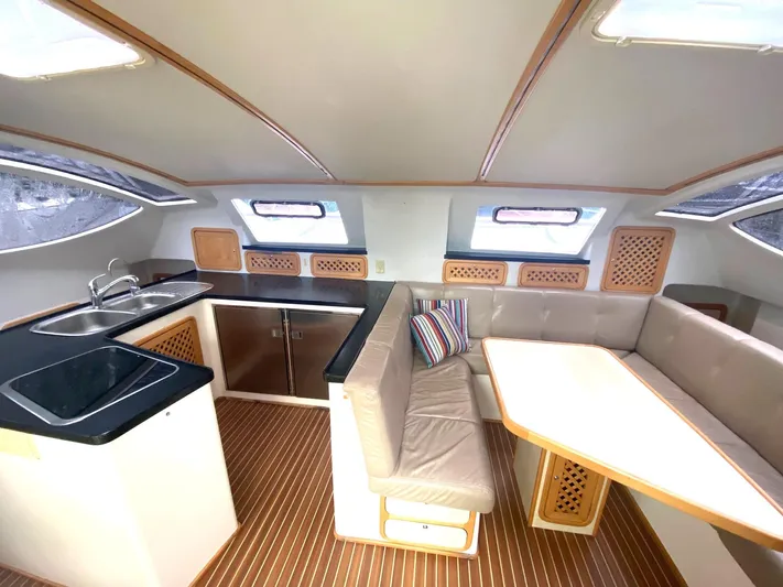 Ronin Yacht Photos Pics Interior of 2016 Celtic Yachts 40, featuring a modern kitchen and cozy dining area.