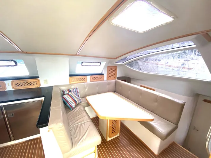 Ronin Yacht Photos Pics Interior of 2016 Celtic Yachts 40, featuring a cozy seating area with a table.