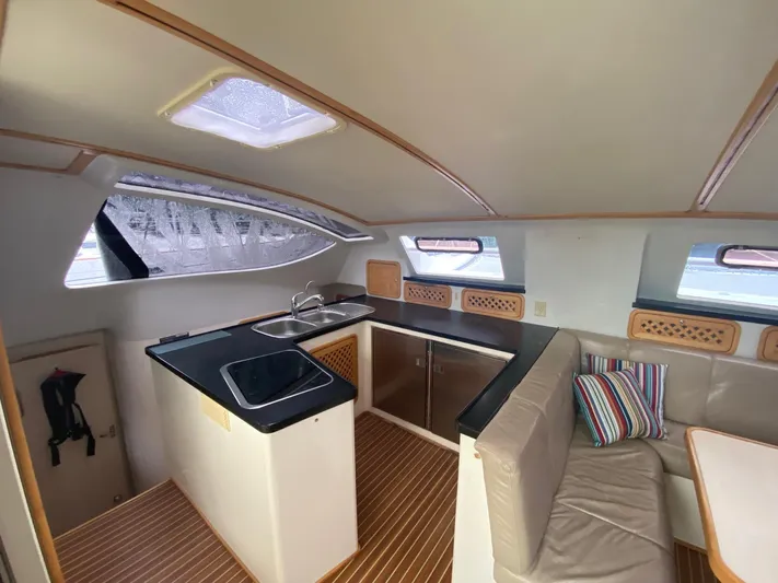 Ronin Yacht Photos Pics Interior of 2016 Celtic Yachts 40, featuring a modern kitchen and cozy seating area.