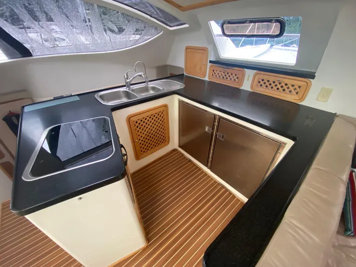 Ronin Yacht Photos Pics Modern kitchen in 2016 Celtic Yachts 40, featuring sleek countertops and stainless steel appliances.