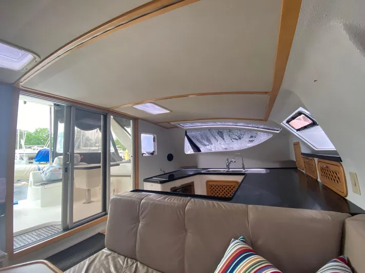 Ronin Yacht Photos Pics Interior of 2016 Celtic Yachts 40, featuring modern kitchen and comfortable seating area.