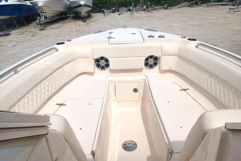  Yacht Photos Pics 2025 Grady-White Freedom 275 boat interior with spacious seating and modern design.