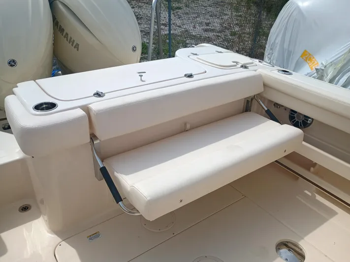  Yacht Photos Pics 2025 Grady-White Freedom 275 boat interior with foldable seating and Yamaha engines.