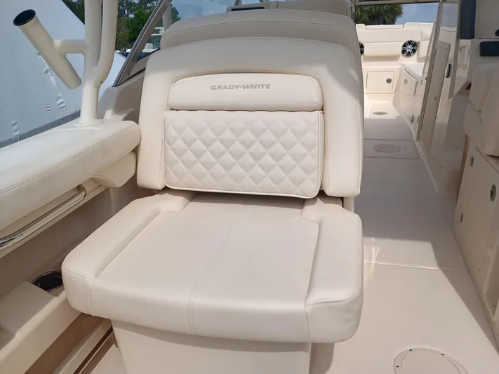  Yacht Photos Pics 2025 Grady-White Freedom 275 boat interior with luxurious white seating.