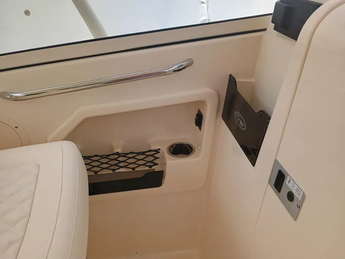  Yacht Photos Pics Interior of 2025 Grady-White Freedom 275 boat, featuring seating and storage compartments.