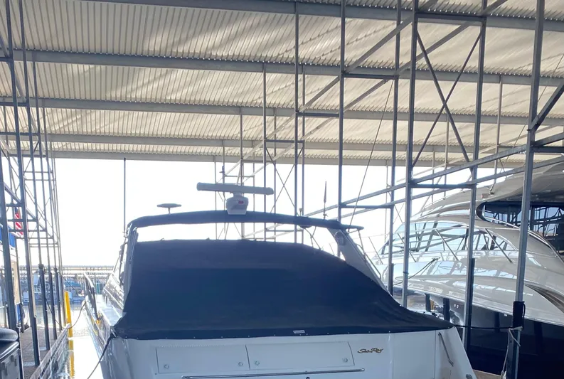  Yacht Photos Pics 1998 Sea Ray 500 Sundancer yacht docked in a covered marina.