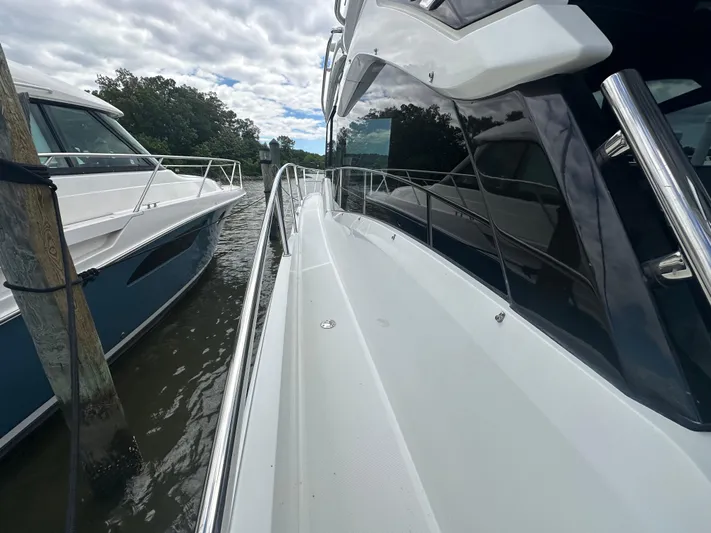 Sea Addendum Yacht Photos Pics 2021 Galeon 425 HTS yacht docked beside another boat on a cloudy day.