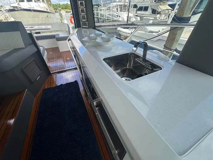 Sea Addendum Yacht Photos Pics Modern kitchen area on 2021 Galeon 425 HTS yacht with sleek countertop and sink.