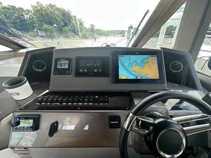 Sea Addendum Yacht Photos Pics Helm of 2021 Galeon 425 HTS yacht with navigation screens and steering wheel.