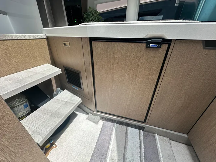 Sea Addendum Yacht Photos Pics 2021 Galeon 425 HTS interior with wooden cabinetry and steps, featuring modern design elements.