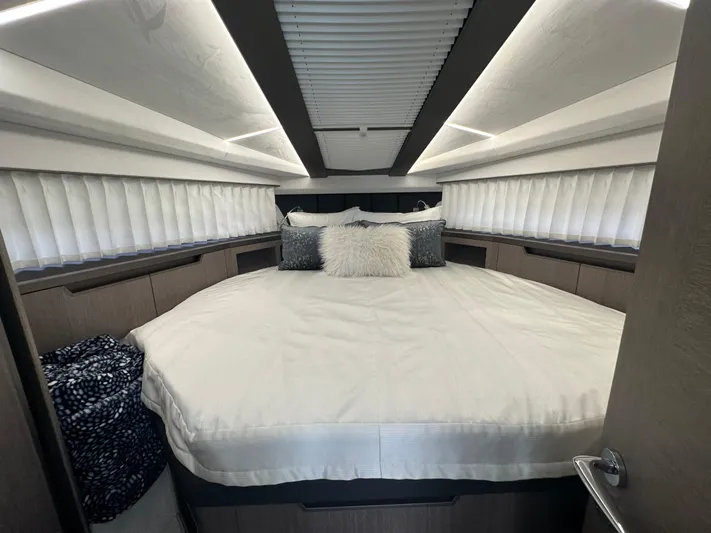 Sea Addendum Yacht Photos Pics Luxurious bedroom interior of 2021 Galeon 425 HTS yacht with elegant bedding and modern design.