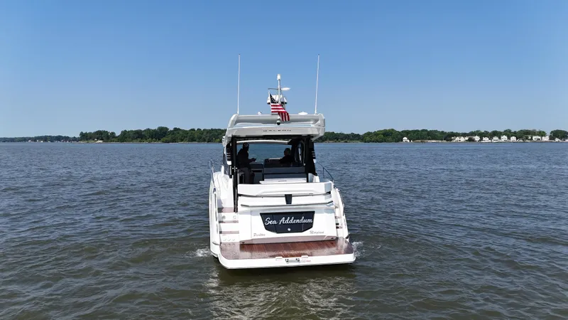 Sea Addendum Yacht Photos Pics 2021 Galeon 425 HTS yacht cruising on a calm lake under a clear blue sky.