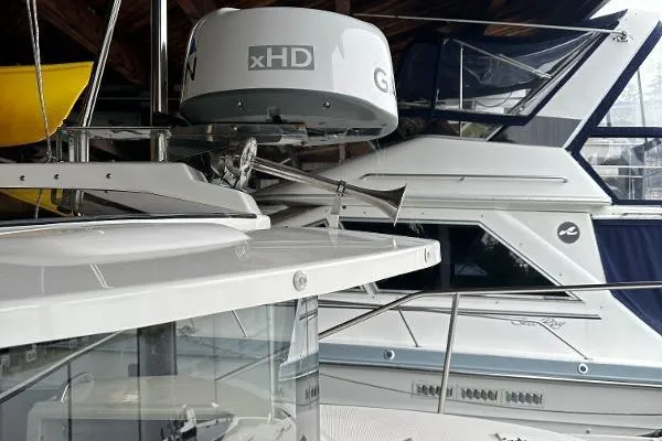  Yacht Photos Pics 2021 Ranger Tugs R-27 boat with radar equipment in a marina setting.