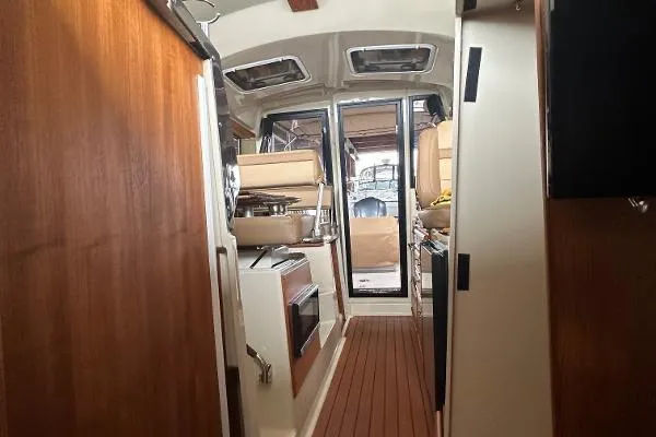  Yacht Photos Pics Interior of 2021 Ranger Tugs R-27 boat with wood finishes and modern amenities.