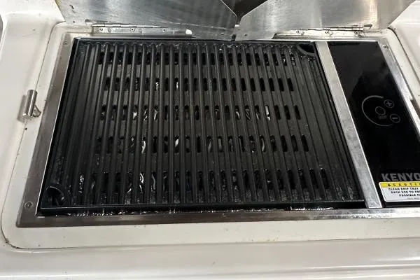  Yacht Photos Pics Outdoor grill on 2021 Ranger Tugs R-27 boat, featuring Kenyon electric cooktop.