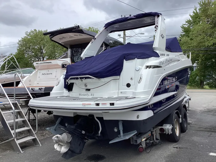 Pat.pending Yacht Photos Pics 2022 Monterey 295 Sport Yacht on trailer, covered, parked outdoors.