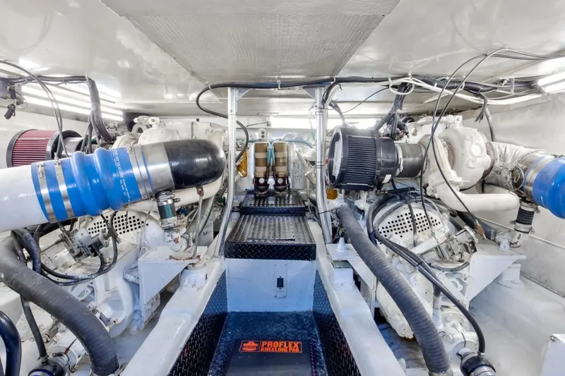  Yacht Photos Pics Engine room of 1999 Ocean Yachts 48 Super Sport, showcasing dual engines and mechanical components.