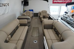 2024 Sun Tracker Party Barge 22 XP3 interior with beige seating and modern design.