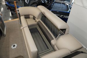 2024 Sun Tracker Party Barge 22 XP3 interior seating with storage compartment open.