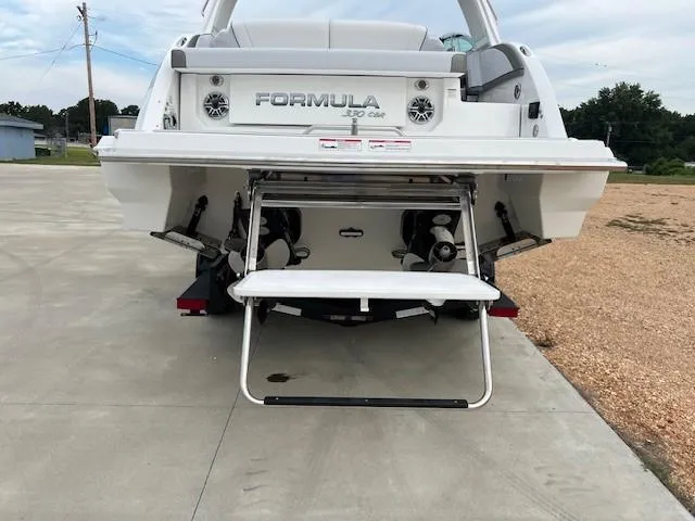  Yacht Photos Pics 2025 Formula 330 Crossover Bowrider I/O, rear view with swim platform and ladder.
