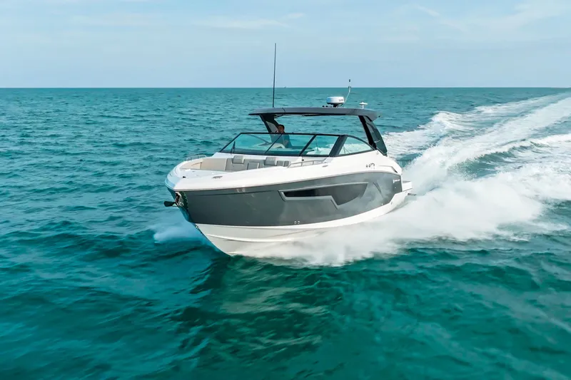  Yacht Photos Pics 2026 Cruisers Yachts 34 GLS OB speeding on open sea, showcasing sleek design.