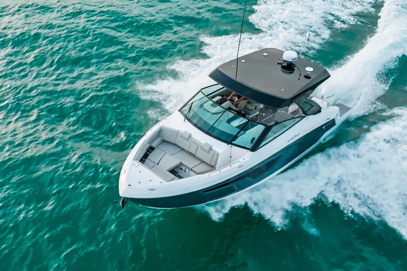  Yacht Photos Pics 2026 Cruisers Yachts 34 GLS OB cruising on turquoise waters.