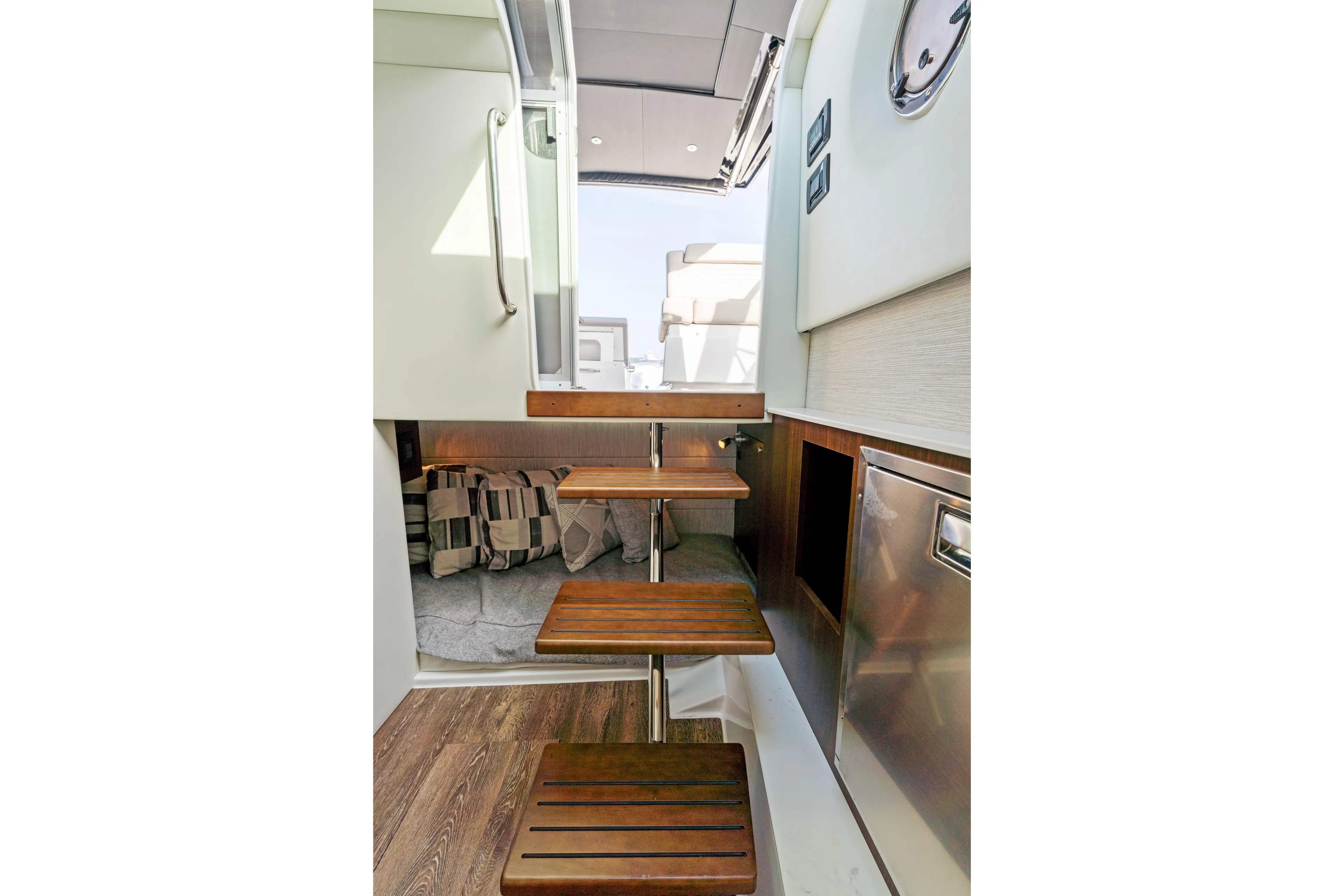 Yacht Photos Pics Interior view of 2026 Cruisers Yachts 34 GLS OB, featuring wooden steps and modern design.
