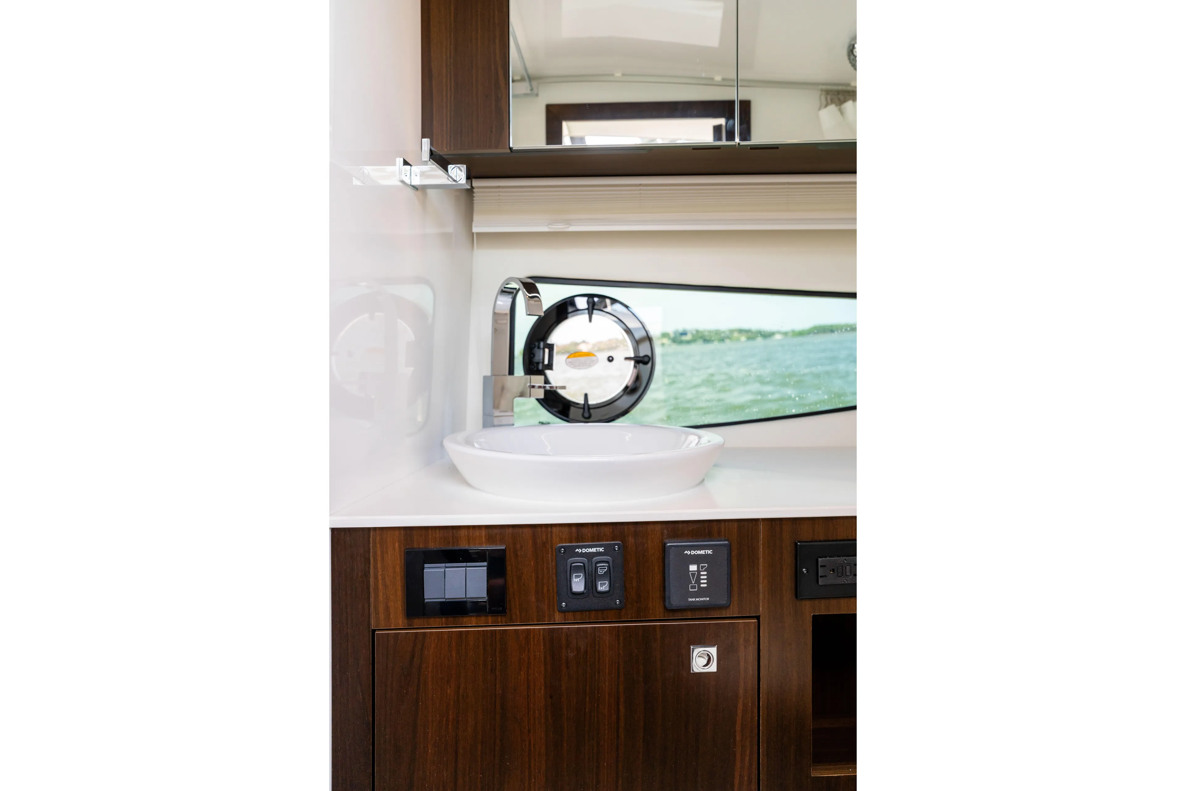  Yacht Photos Pics Luxurious bathroom interior of 2026 Cruisers Yachts 34 GLS OB with modern sink and controls.