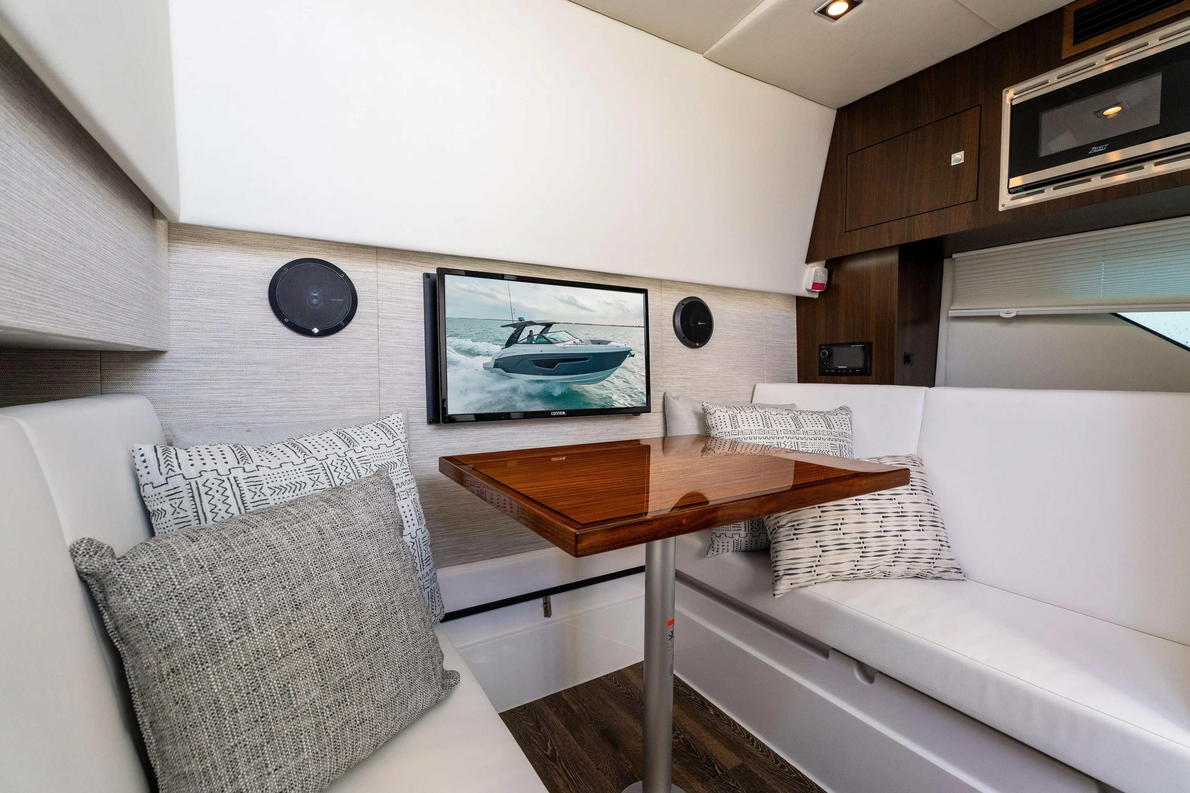  Yacht Photos Pics Luxurious interior of 2026 Cruisers Yachts 34 GLS OB with modern seating and entertainment system.