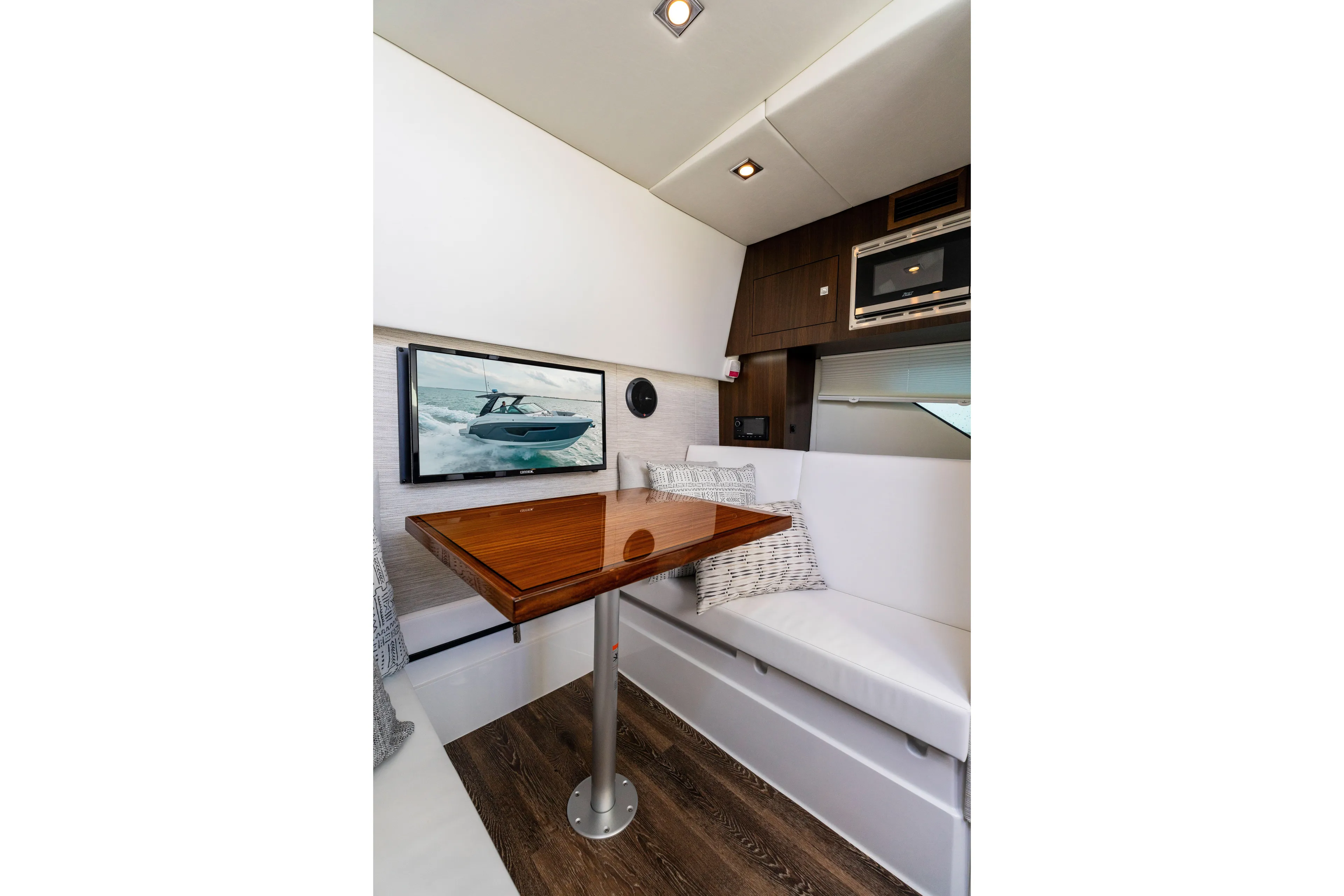  Yacht Photos Pics Interior of 2026 Cruisers Yachts 34 GLS OB, featuring a cozy seating area and modern amenities.
