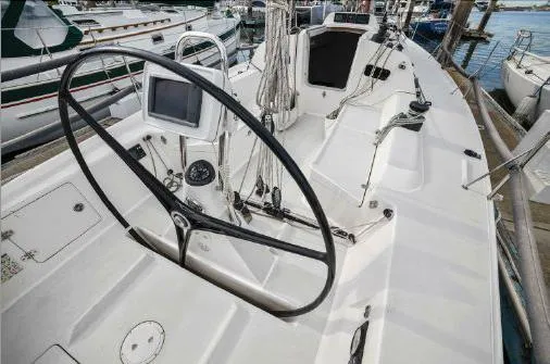 J/111 Yacht Photos Pics 2013 J Boats J/111 sailboat cockpit with steering wheel and navigation equipment.