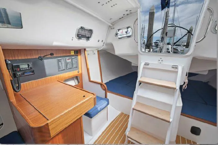 J/111 Yacht Photos Pics Interior of 2013 J Boats J/111 sailboat with navigation station and cabin view.