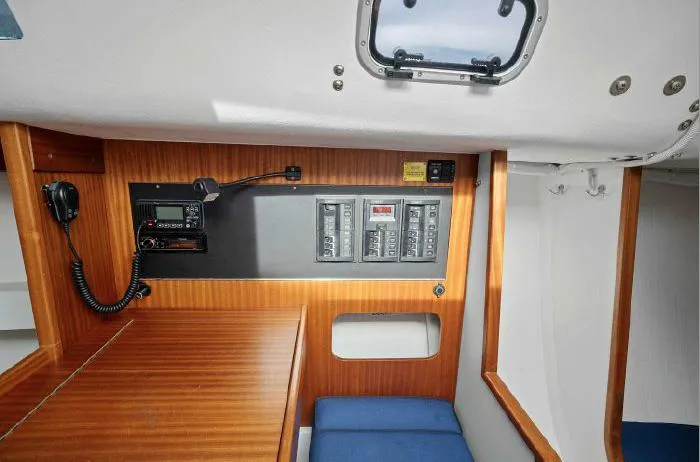 J/111 Yacht Photos Pics 2013 J Boats J/111 interior with control panel and wooden finish.
