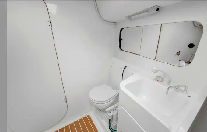 J/111 Yacht Photos Pics 2013 J Boats J/111 yacht bathroom with sink, toilet, and mirror.