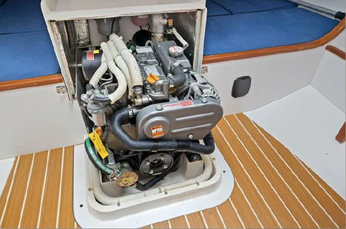 J/111 Yacht Photos Pics Engine compartment of a 2013 J Boats J/111 sailboat, showcasing the engine and interior details.