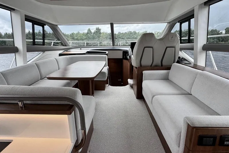  Yacht Photos Pics Luxurious interior of 2022 Princess F50 yacht with elegant seating and panoramic windows.