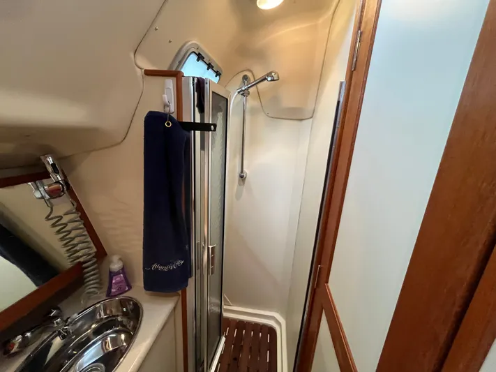  Yacht Photos Pics Compact bathroom in a 2004 Hunter 41 yacht with shower and sink.