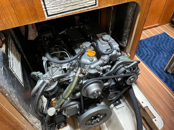  Yacht Photos Pics Engine compartment of a 2004 Hunter 41 sailboat, showcasing detailed mechanical components.